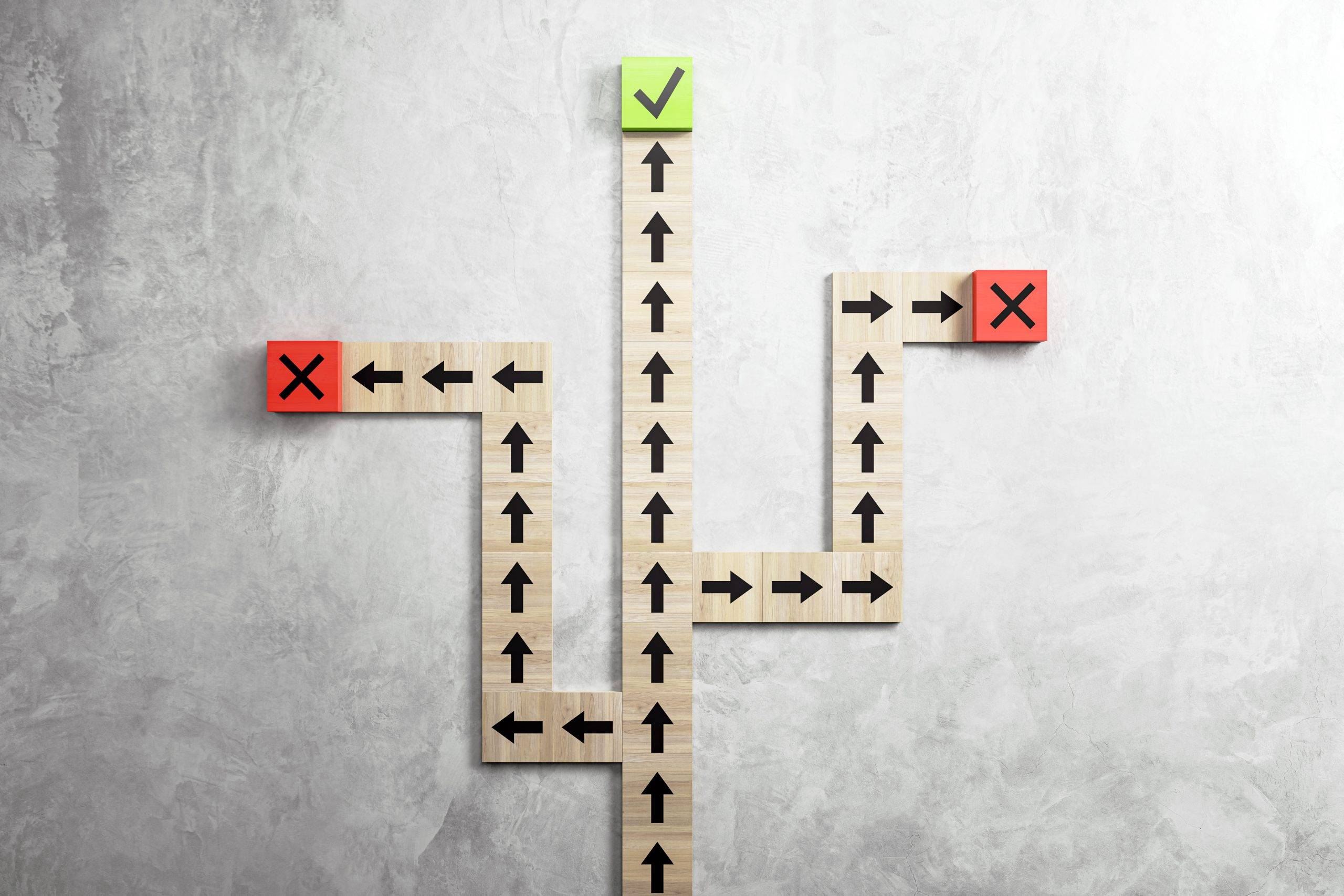 wooden blocks with arrows pointing towards green check mark red crosses depicting decision making textured gray background concept choices 3d rendering scaled HOW TO FIND RELIABLE SUPPLIERS IN CHINA: ALIBABA VS. TRADE SHOWS VS. AGENTS