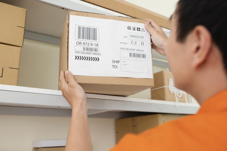 close up young man taking box from shelf Private Label close up young man taking box from shelf Private Label