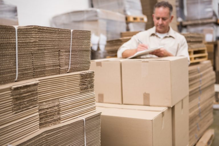 warehouse worker checking his list clipboard Storage warehouse worker checking his list clipboard Storage