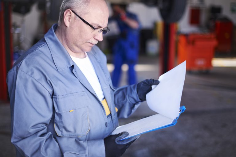 mechanic checking car report Supplier Management